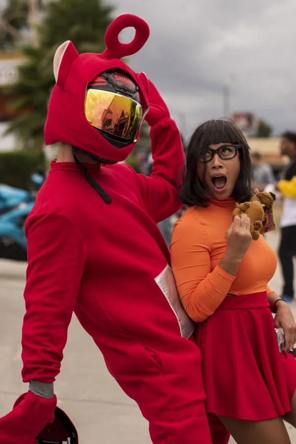 Playful Halloween portrait in red and orange costumes
