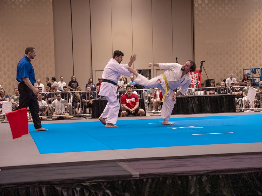 Martial arts competition on a blue mat