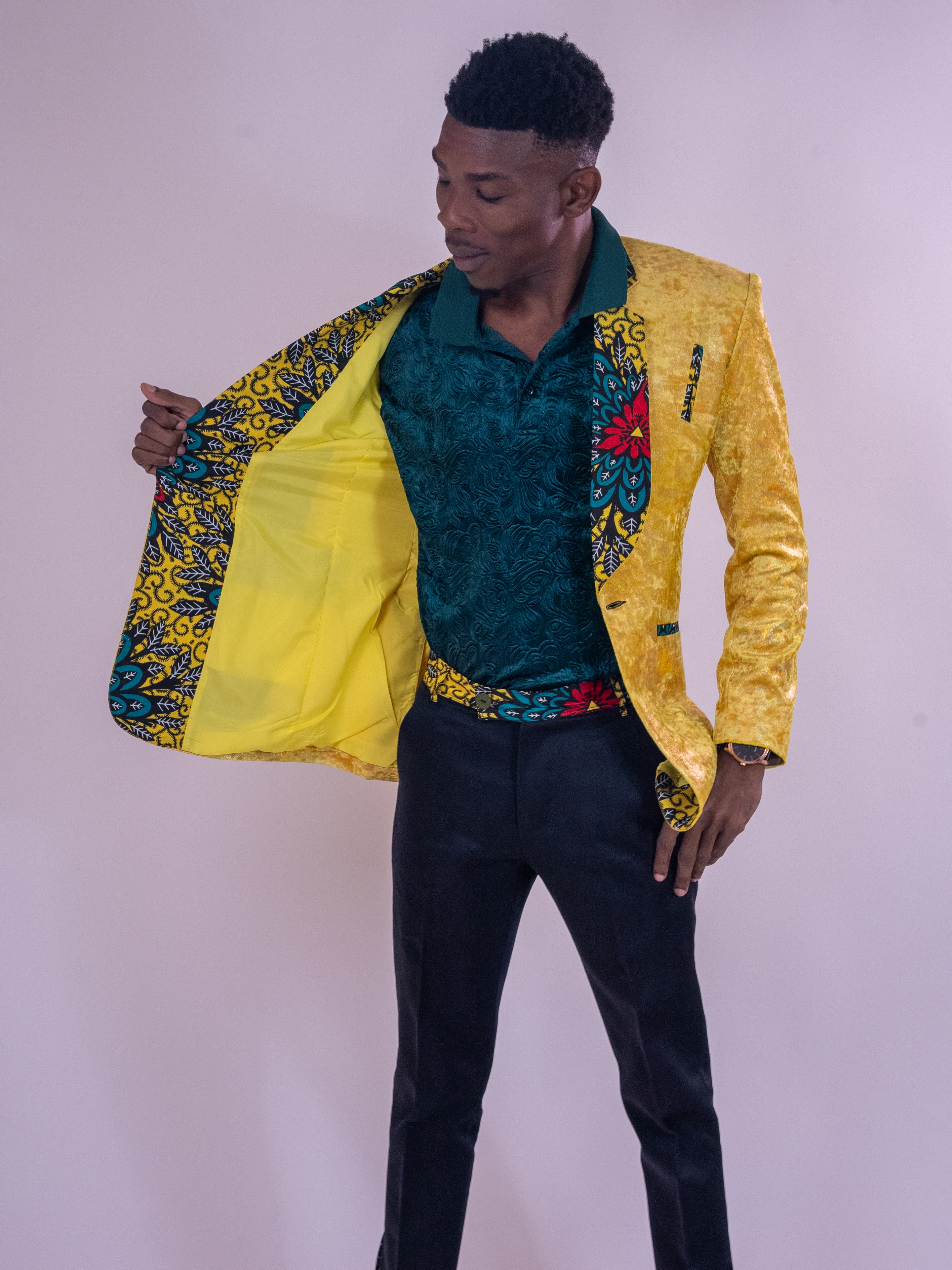 Standing portrait showing the patterned lining of a yellow jacket