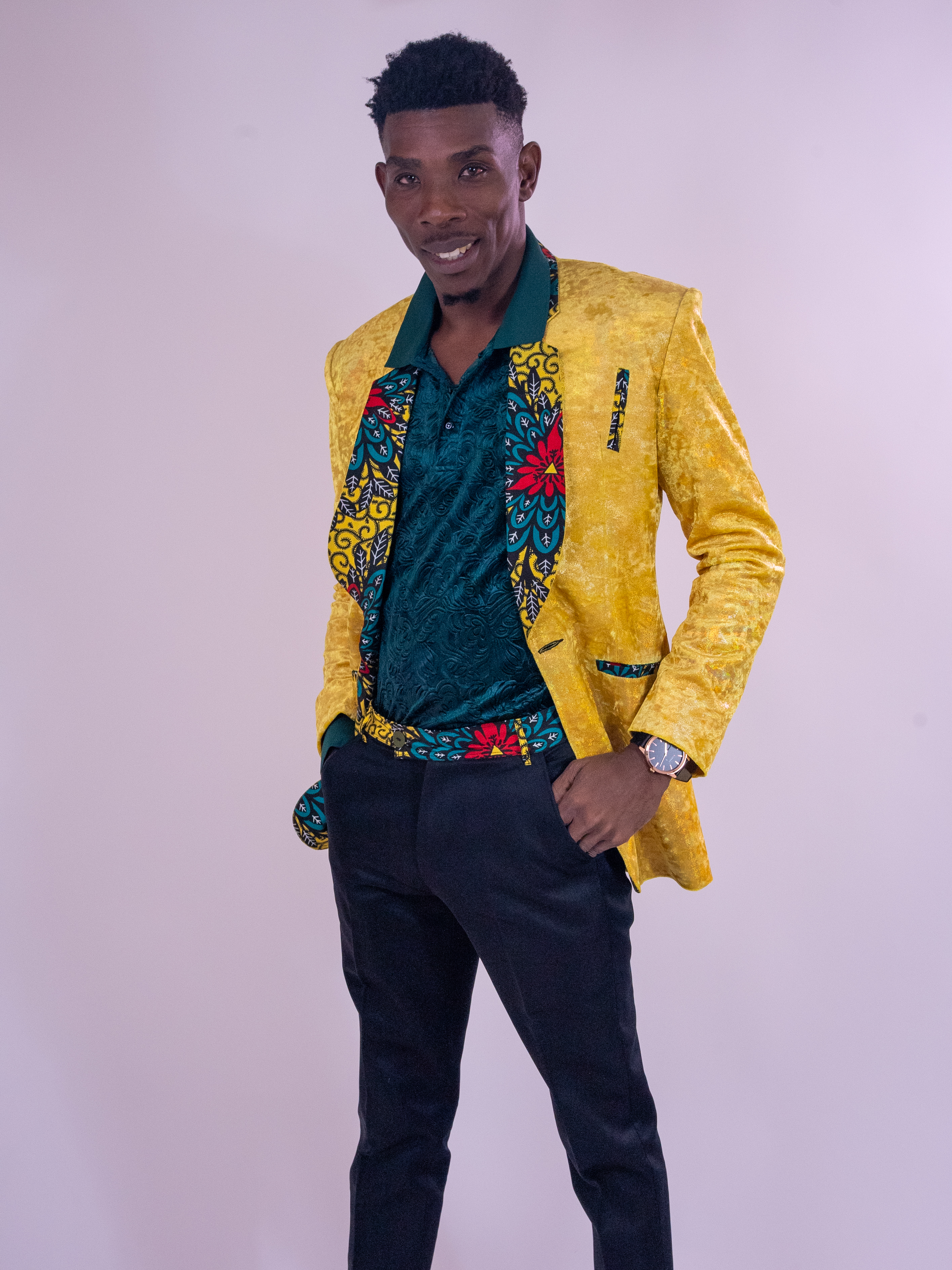 Standing portrait in a yellow jacket with hands in pockets