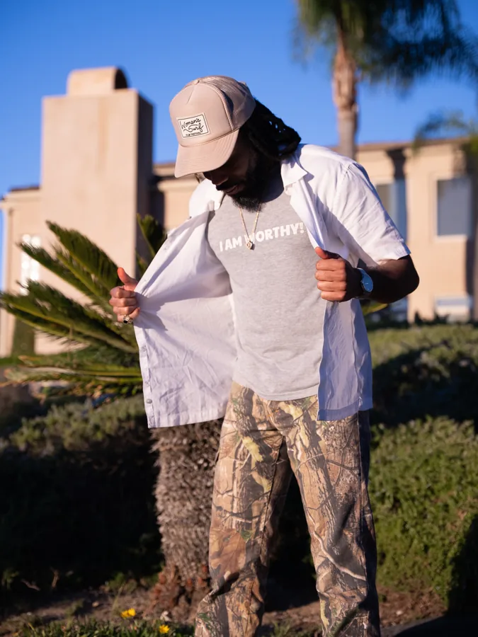 Outdoor portrait beside palms and architecture